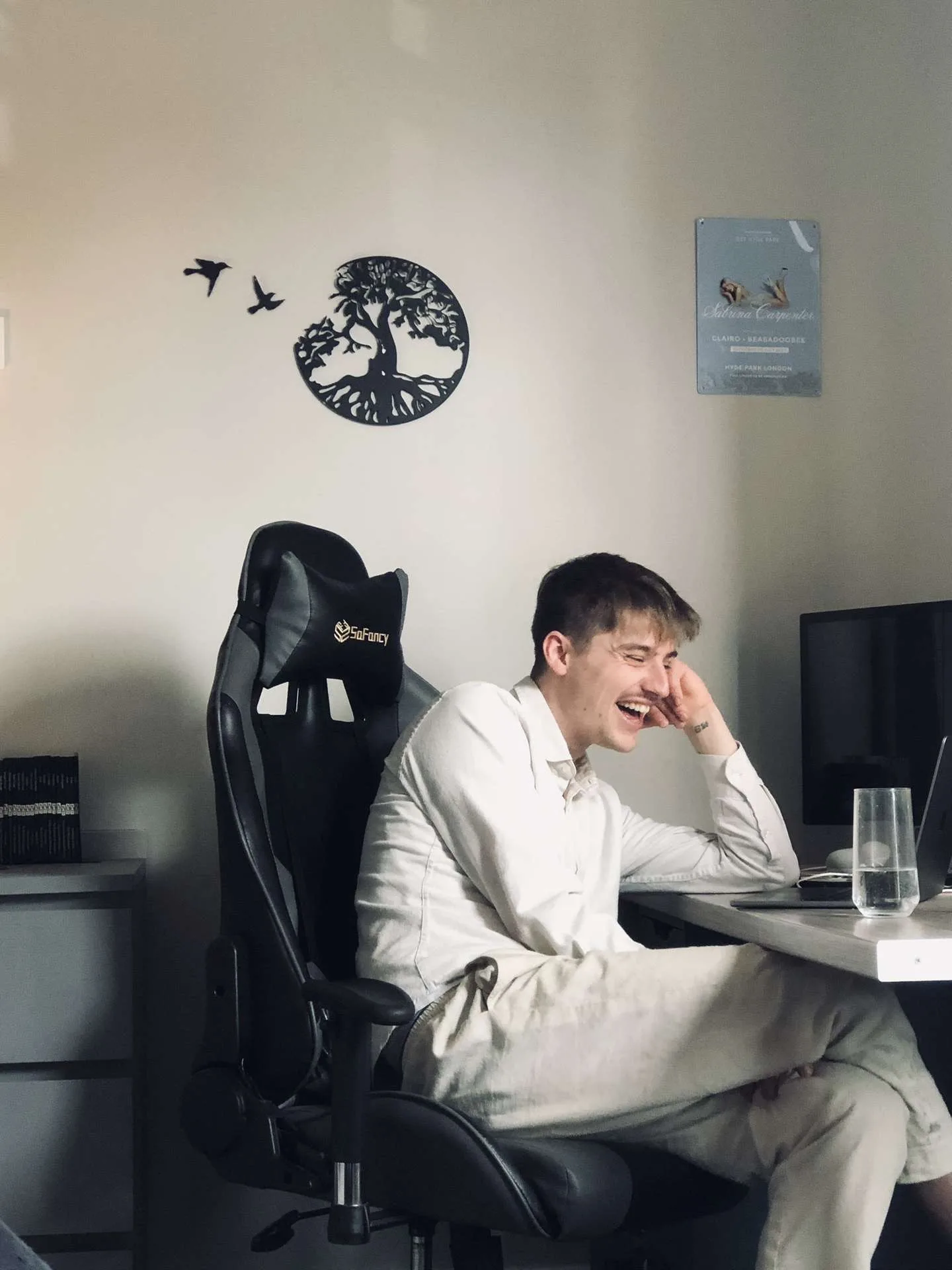 Declan Shinnick laughing at his desk